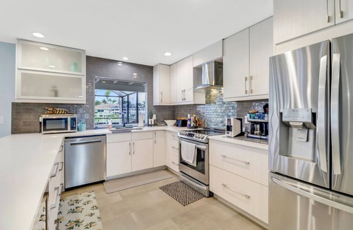 Yacht Club Villa | Coastal Paradise 1013 Modern European Style Waterfront Home w/Gourmet Kitchen & heated Pool