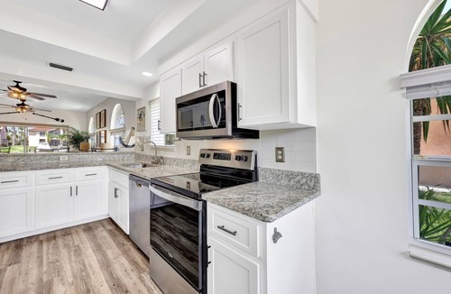 Caloosahatchee Villa | Enchanting tropical waterfront villa with boat slip, bikes, kayaks heated pool!