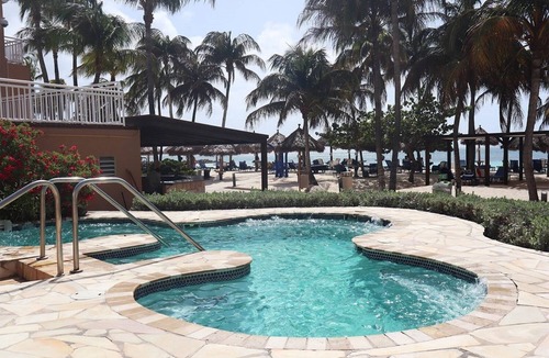 Palm Beach Hotel | Enjoy a Peaceful Stay with Great Amenities! Outdoor Pools, Beach, Free Parking!