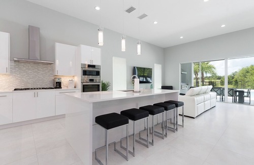 Reunion Villa | Modern Luxury Villa | 5BR, 5 Bath Luxe Home w/Private Pool, Arcade, and Theater Near Disney