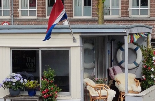 Grachtengordel-West Boat Rental | Pantheos Houseboat in Prinsengracht with a view of the Westerkerk the Landmark.