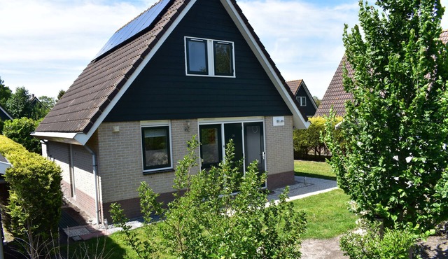 Comfortable holiday home near the beach with garden, with playground and pool