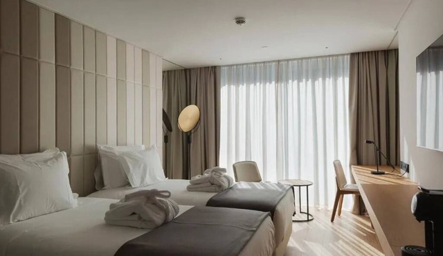 Dive into Lisbon Nights: Rooftop Pool & Magical Light Show Views