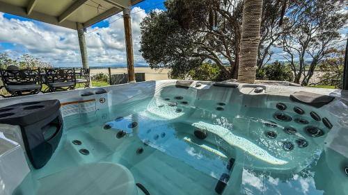 Large riverfront home with spa and stage in Te Kopuru