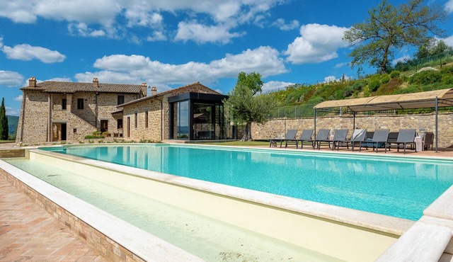 Villa Lago is set against a hillside of luscious greenery olive groves in Torricella