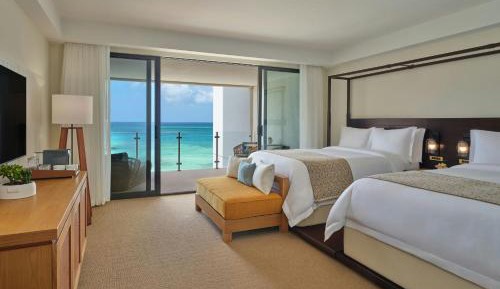 Deluxe Double Room with Two Double Beds, Balcony and Partial Ocean View